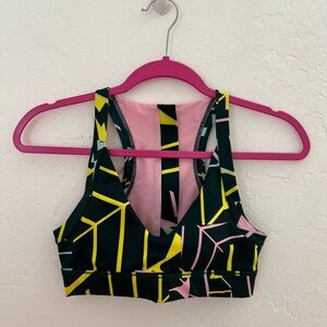 Puma Sports Bra. Workout top with zipper and elastic band in the back.